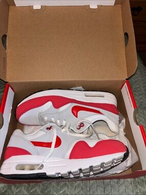 Big boys red & white Nike tennis shoes